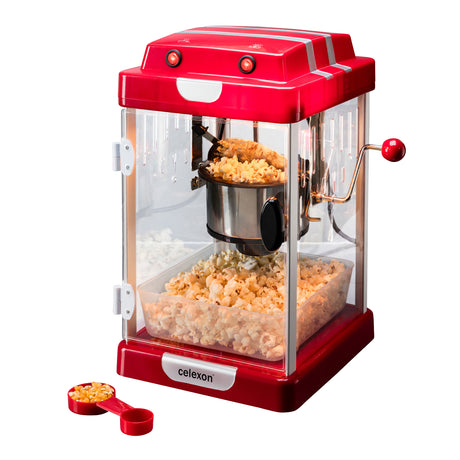 celexon CinePop CP1000 Popcorn-Maschine - Schrägansicht mit Popcorn und Dosierlöffel